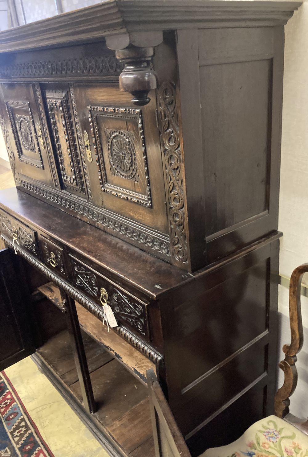 A late 18th century carved oak court cupboard, width 130cm, depth 52cm, height 170cm